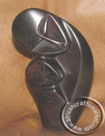Abtract soapstone embracing family African Soapstone Abstract embracing mother and child
