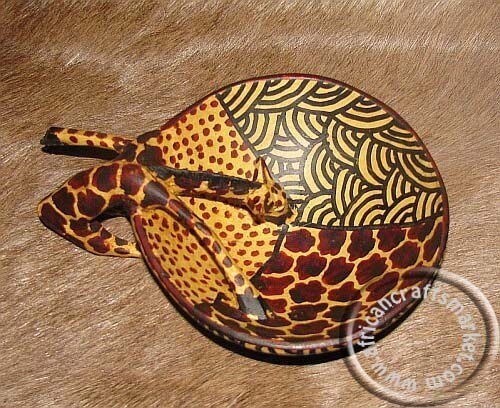 African giraffe drinking fruit bowl