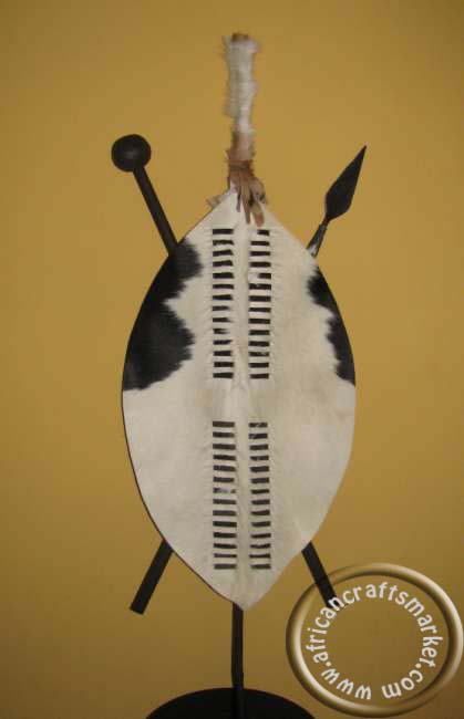 detail of the black and white Nguni cowhide pattern on a traditional 75cm Zulu warrior shield.