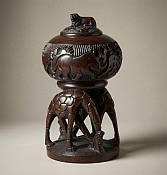 Handcrafted 25cm African wood giraffe storage box with a hand-carved lid and traditional tribal patterns