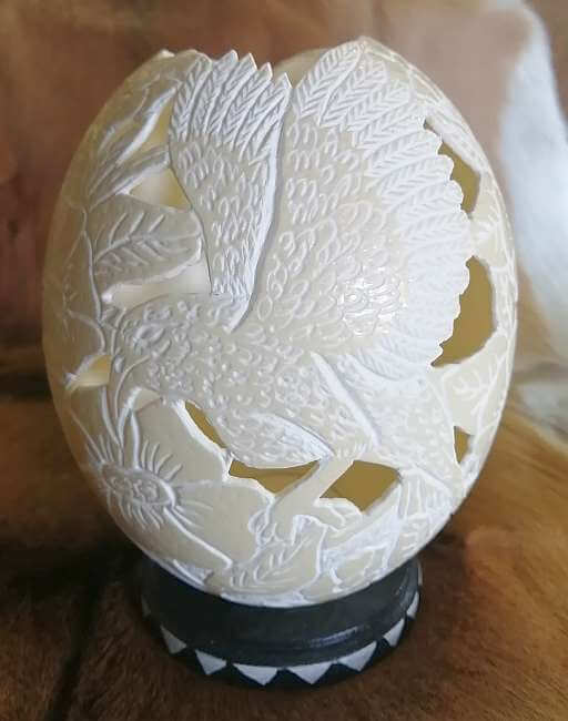 Carved ostrich egg - Bird and candle Carved ostrich egg - Bird and candle