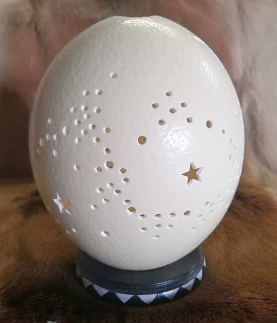 Carved ostrich egg - Stars and candle Carved ostrich egg - Stars and candle