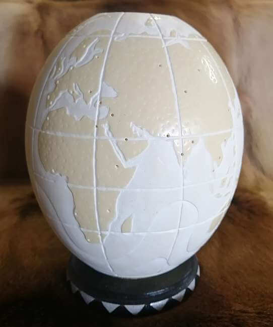 Carved ostrich egg - World map and candle Carved ostrich egg - World map and candle