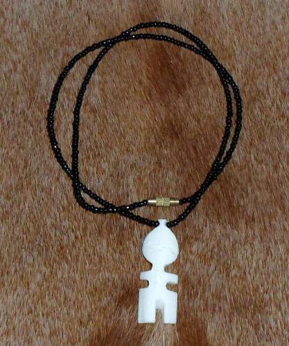 fertility doll bone necklace African fertility doll bone necklace