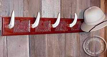 African wall-mounted hanging rack with genuine warthog tusk