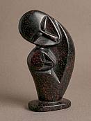 Handcrafted African Soapstone Family Statue Handcrafted African soapstone carving of an abstract family silhouette, authentic cultural folk art home accent