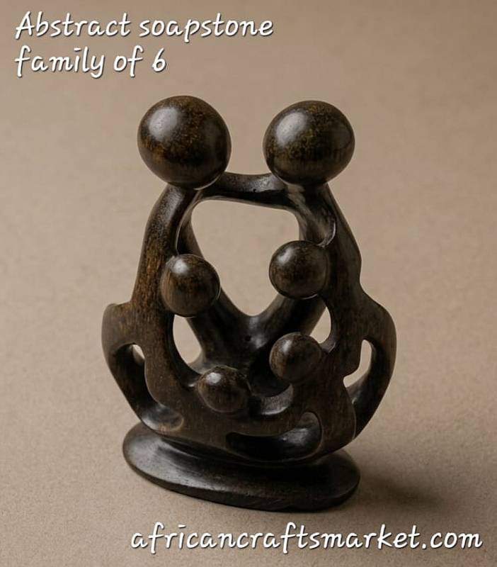 Abstract African soapstone family sculpture featuring 6 heads intertwined in a smooth, polished unity design for home decor