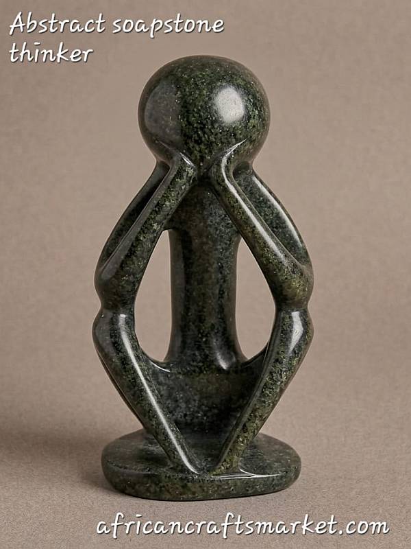 Handcrafted African stone thinking man statue, minimalist abstract soapstone carving featuring a polished smooth finish