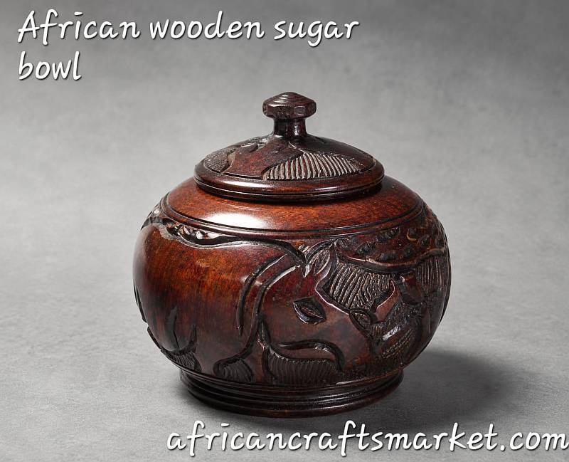 Authentic hand-carved African wooden storage bowl with a matching lid, showcasing polished natural hardwood grain
