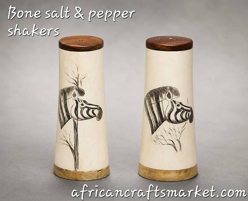 Handcrafted salt and pepper shaker set made from polished regional wood and genuine bone inlay with black scrimshaw animal engravings